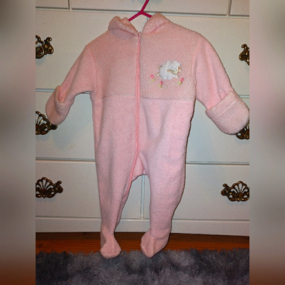 Baby girl pink pram with sheep